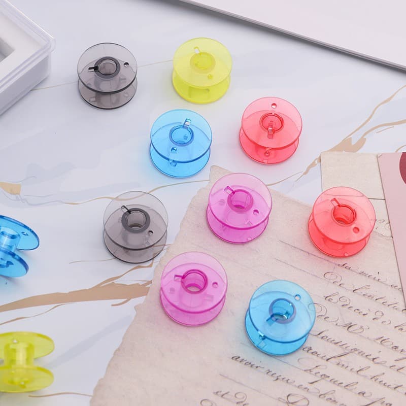 Household multifunctional sewing machine line axis 2518P color transparent plastic shuttle 9 color line scroll scroll household shuttle heart 3