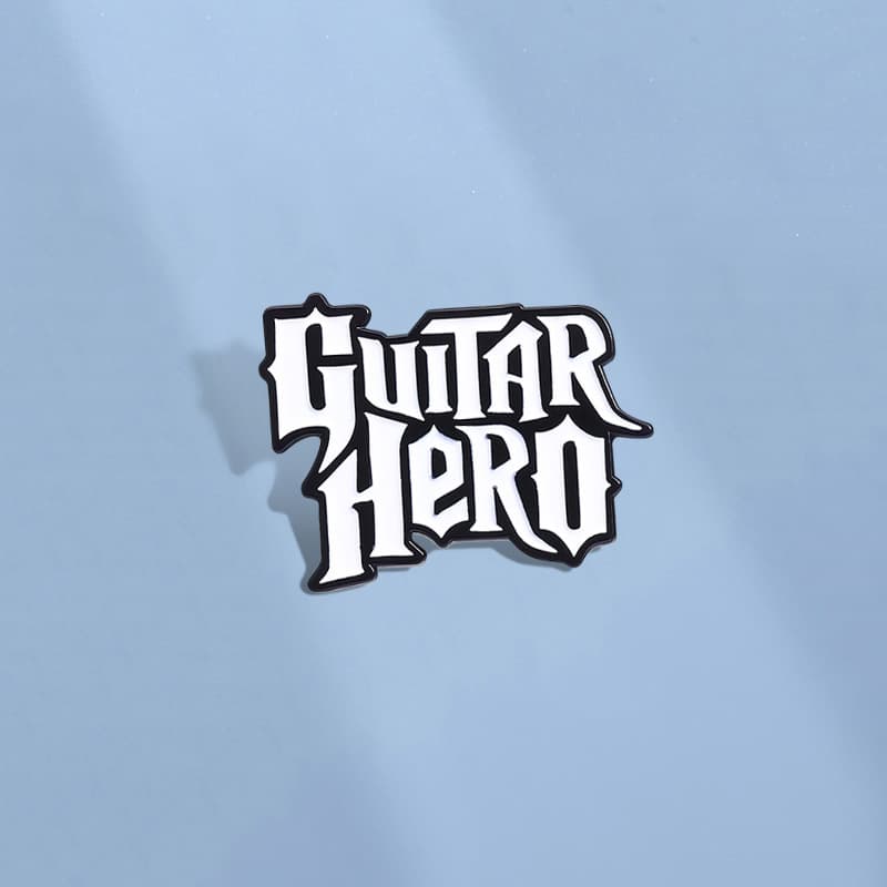 New foreign trade product "GUITAR HERO" film and television peripheral commemorative medals with interesting English letter shape metal chest ornaments